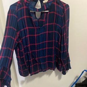 Francesca’s plaid top. Flare end of sleeves.
